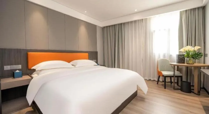 Bed in Echarm Hotel Zhanjiang Zhanchuan Avenue Wanda Plaza