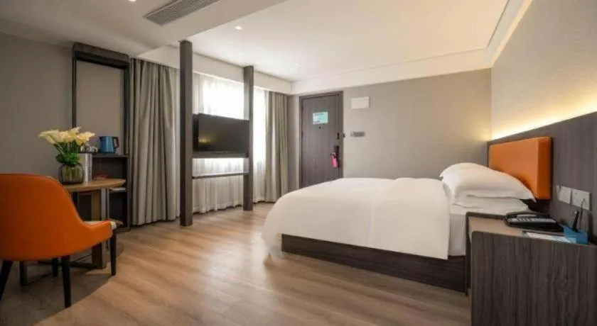 Bed in Echarm Hotel Zhanjiang Zhanchuan Avenue Wanda Plaza
