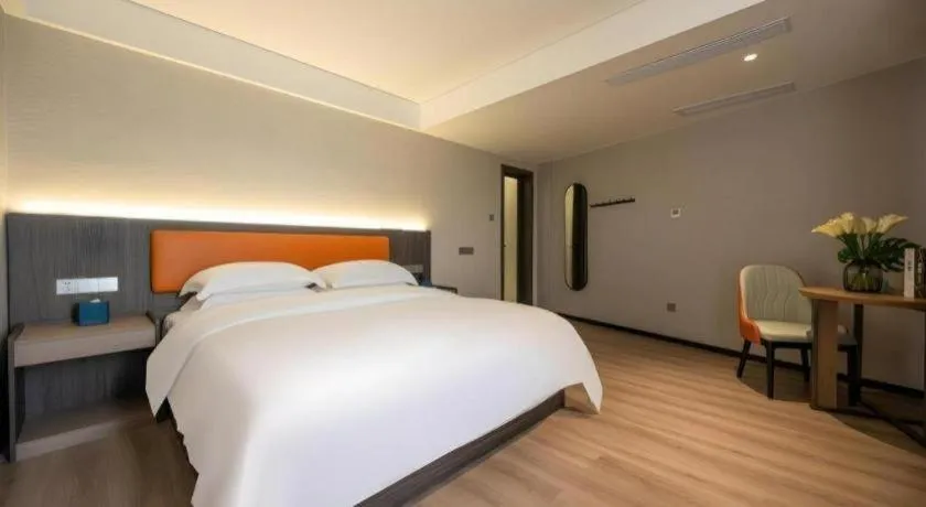 Bed in Echarm Hotel Zhanjiang Zhanchuan Avenue Wanda Plaza