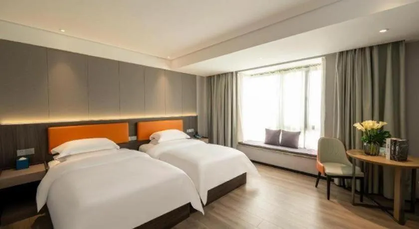 Bed in Echarm Hotel Zhanjiang Zhanchuan Avenue Wanda Plaza