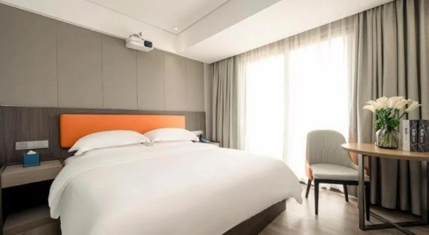Bed in Echarm Hotel Zhanjiang Zhanchuan Avenue Wanda Plaza