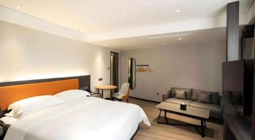 Bed in Echarm Hotel Zhanjiang Zhanchuan Avenue Wanda Plaza