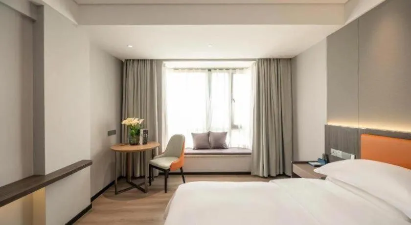 Bed in Echarm Hotel Zhanjiang Zhanchuan Avenue Wanda Plaza