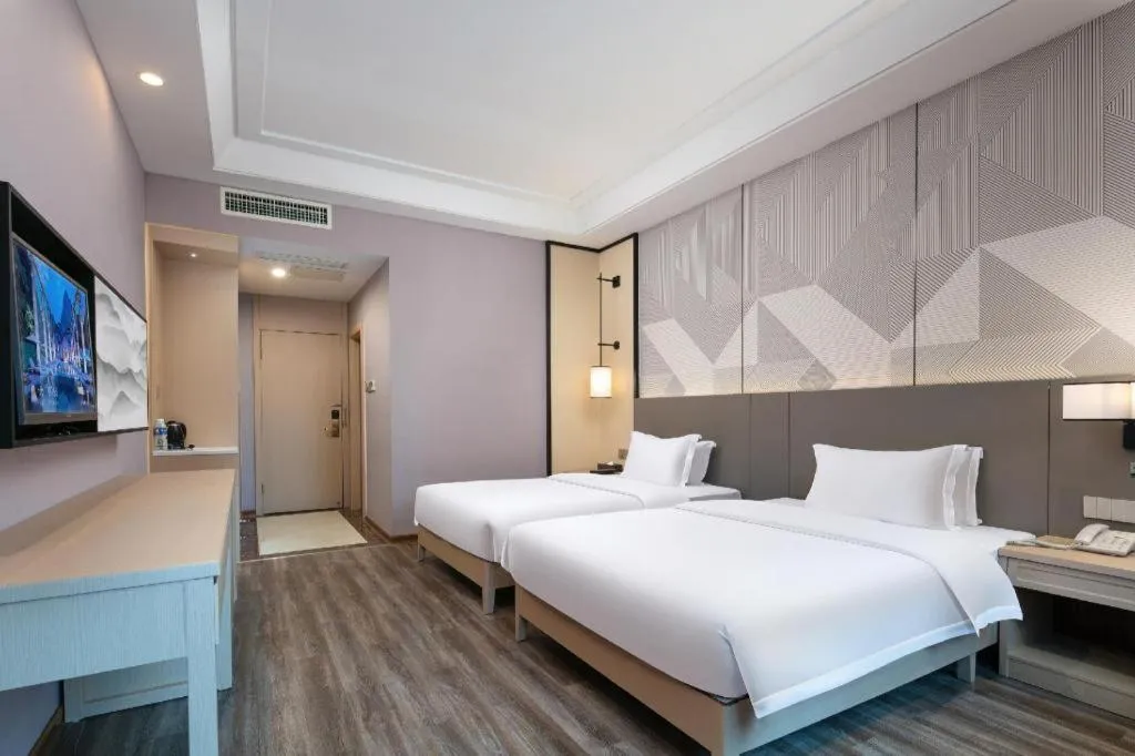 Bed in Borrman Hotel Changsha Yueliang Dao Guanziling Metro Station