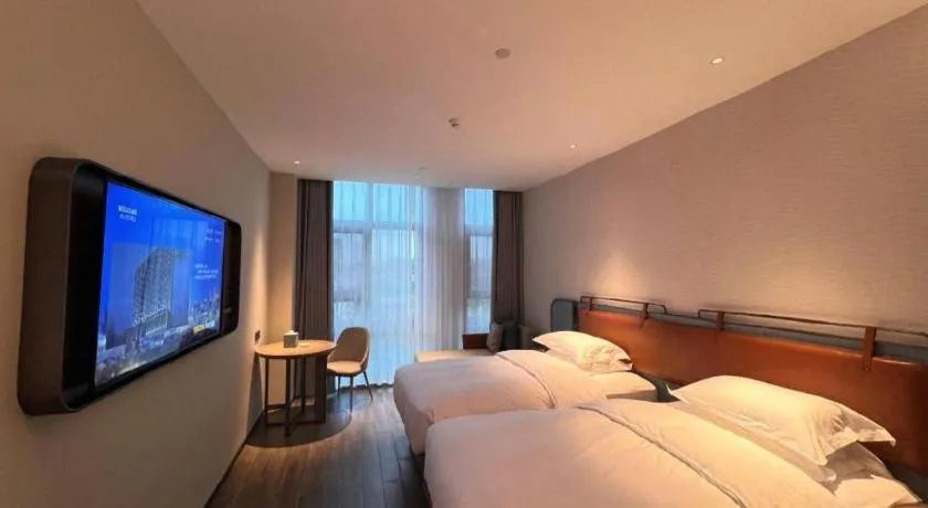 Bed in Echarm Hotel Changsha Huanghua Airport