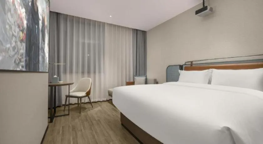 Bed in Echarm Hotel Changsha Huanghua Airport
