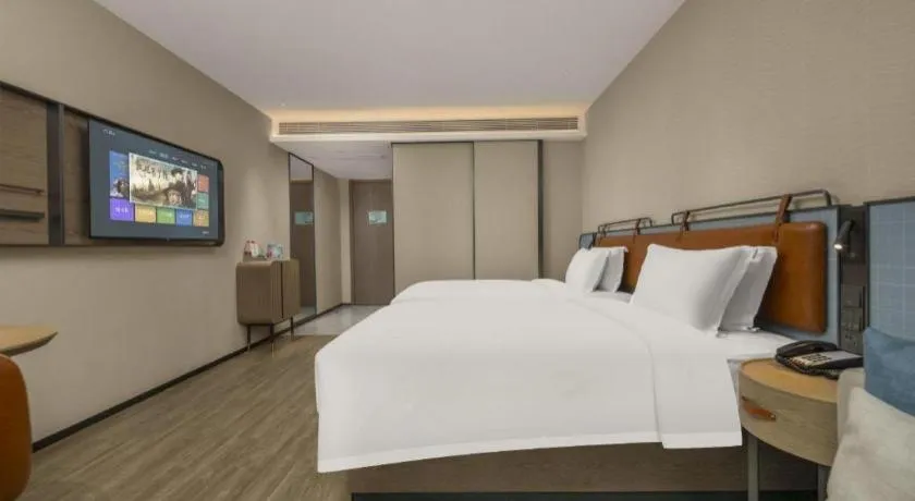 Bed in Echarm Hotel Changsha Huanghua Airport