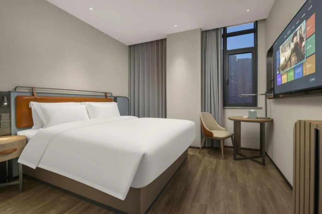 Bed in Echarm Hotel Changsha Huanghua Airport