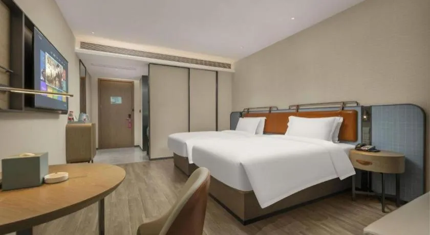 Bed in Echarm Hotel Changsha Huanghua Airport