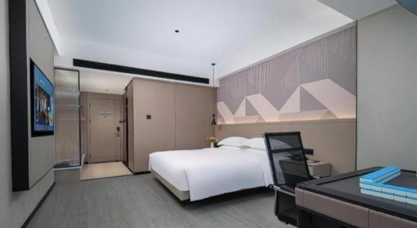 Bed in Borrman Hotel Yongzhou Lingling Ancient Town Government