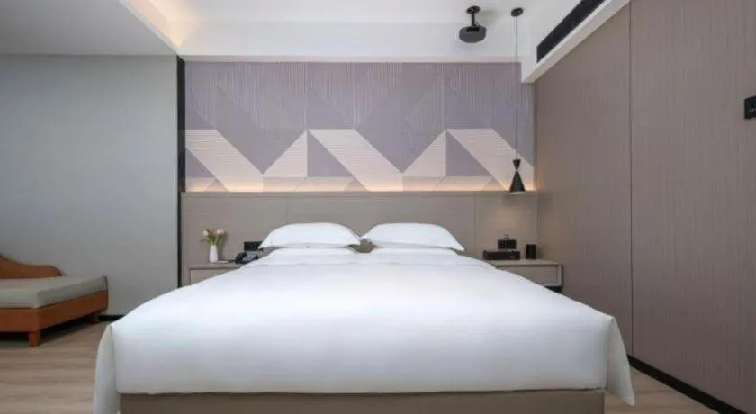 Bed in Borrman Hotel Yongzhou Lingling Ancient Town Government