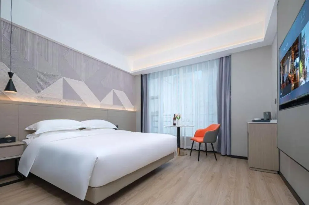 Bed in Borrman Hotel Yongzhou Lingling Ancient Town Government