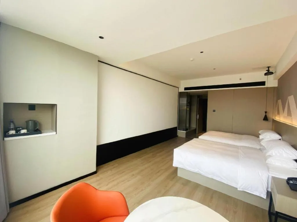 Bed in Borrman Hotel Yongzhou Lingling Ancient Town Government