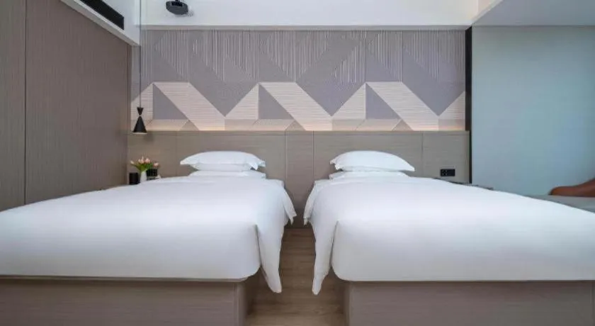 Bed in Borrman Hotel Yongzhou Lingling Ancient Town Government