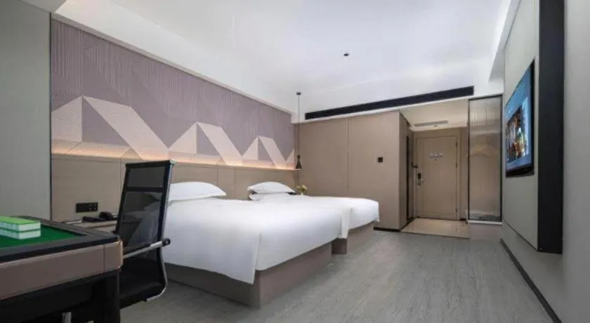 Bed in Borrman Hotel Yongzhou Lingling Ancient Town Government