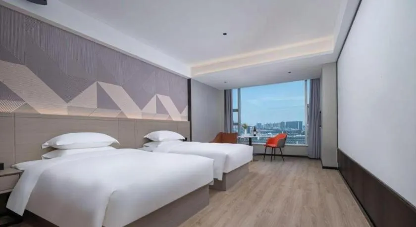 Bed in Borrman Hotel Yongzhou Lingling Ancient Town Government