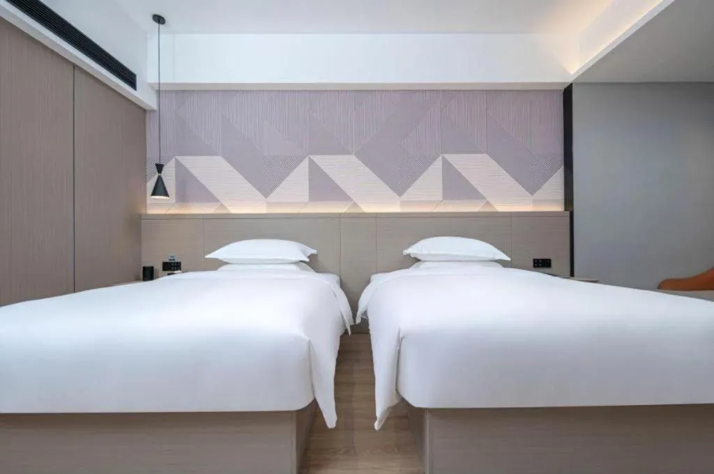 Bed in Borrman Hotel Yongzhou Lingling Ancient Town Government