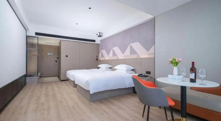 Bed in Borrman Hotel Yongzhou Lingling Ancient Town Government