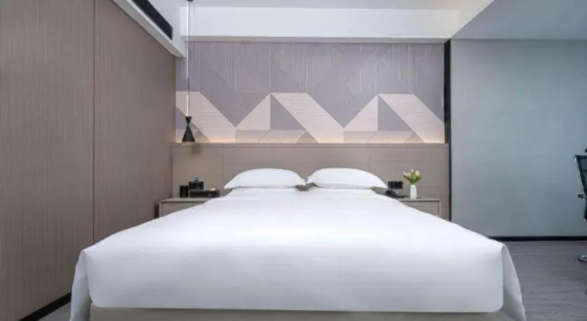 Bed in Borrman Hotel Yongzhou Lingling Ancient Town Government