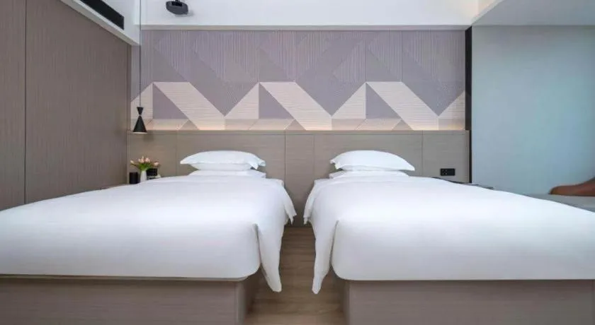 Bed in Borrman Hotel Yongzhou Lingling Ancient Town Government