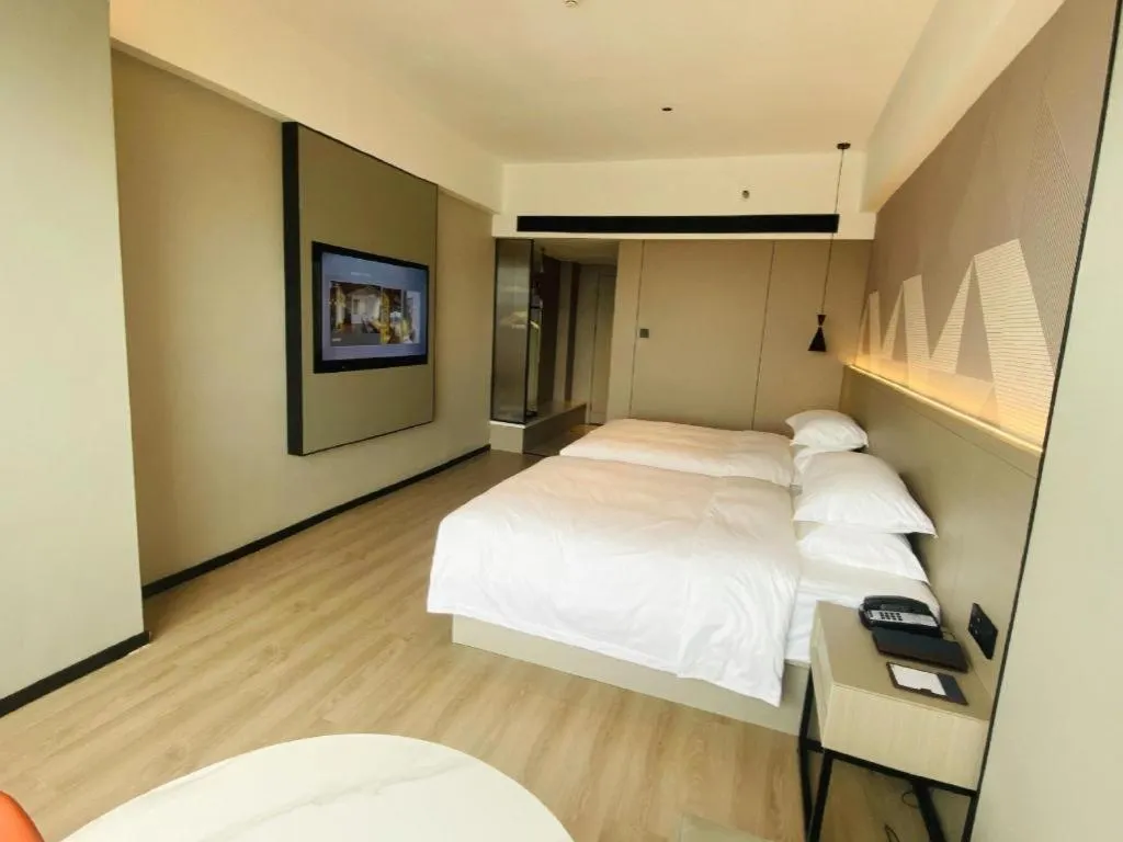 Bed in Borrman Hotel Yongzhou Lingling Ancient Town Government