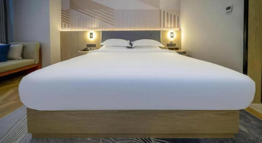 Bed in Borrman Hotel Zhangzhou Baolong Plaza