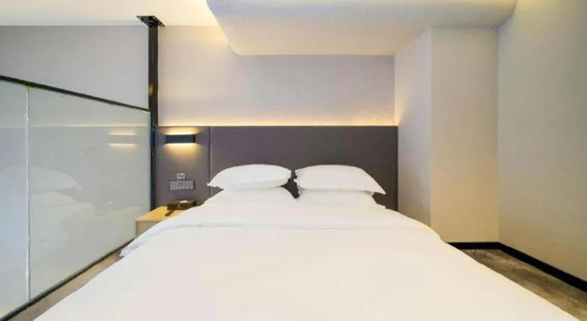 Bed in Borrman Hotel Zhangzhou Baolong Plaza