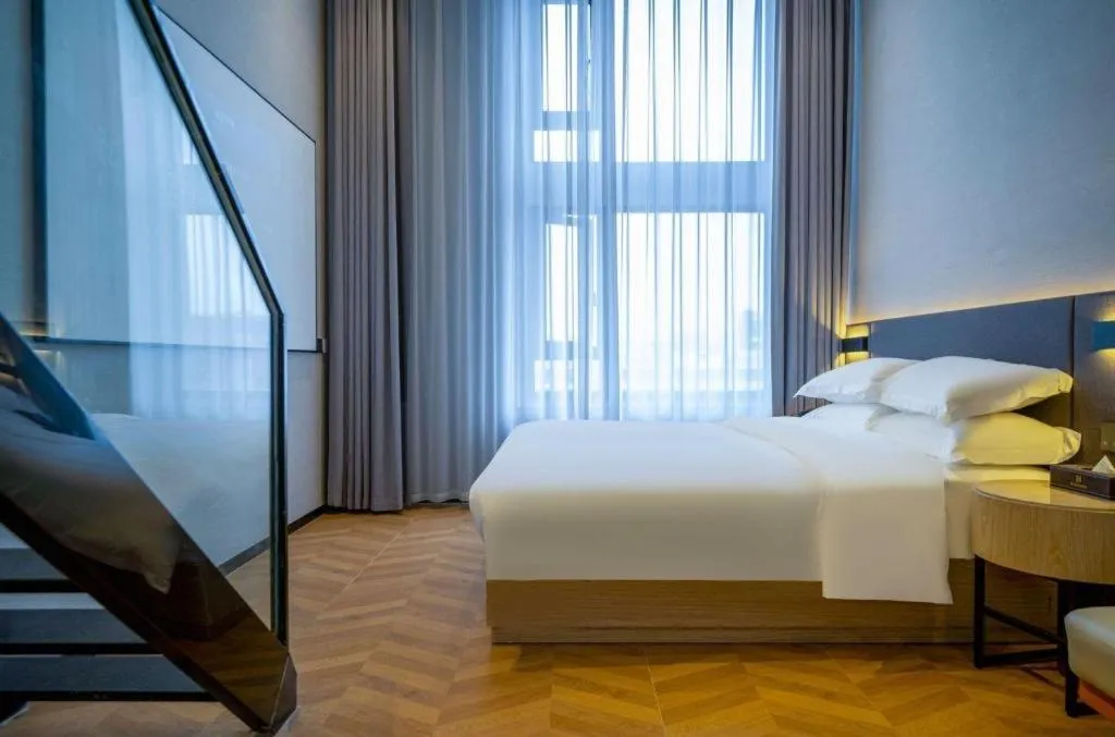 Bed in Borrman Hotel Zhangzhou Baolong Plaza