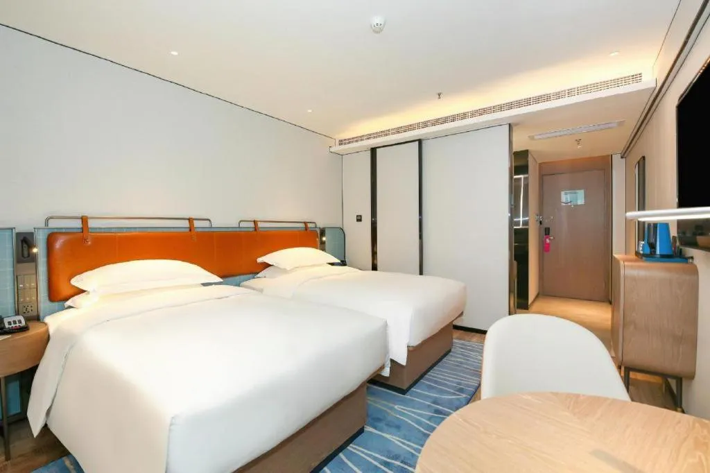 Bed in Echarm Hotel Guangzhou South Railway Station