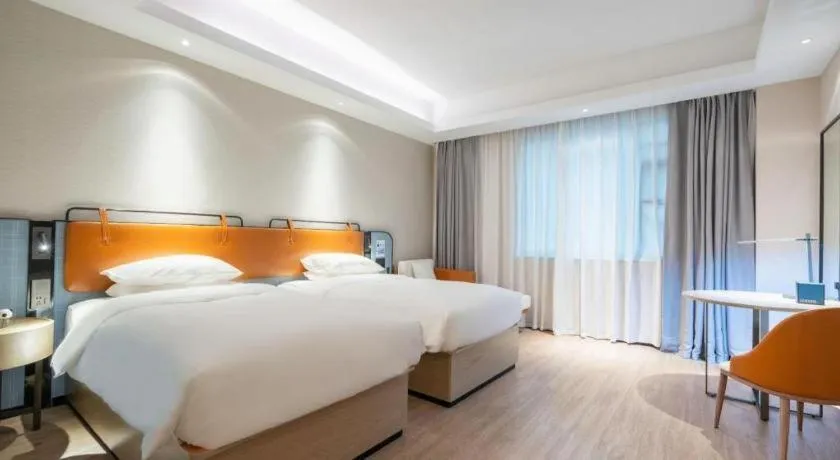 Bed in Echarm Hotel Guangzhou South Railway Station