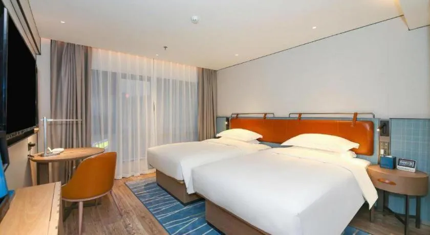 Bed in Echarm Hotel Guangzhou South Railway Station