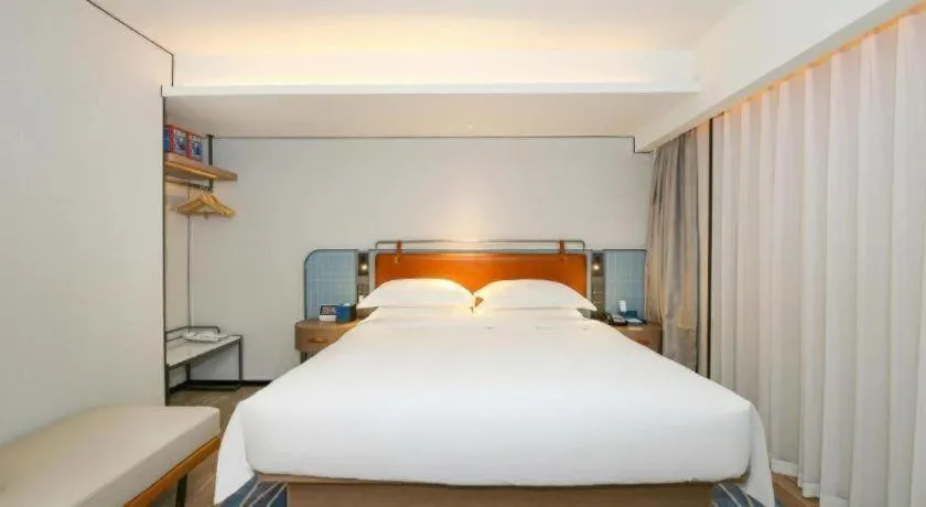 Bed in Echarm Hotel Guangzhou South Railway Station