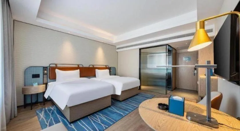 Bed in Echarm Hotel Guangzhou South Railway Station