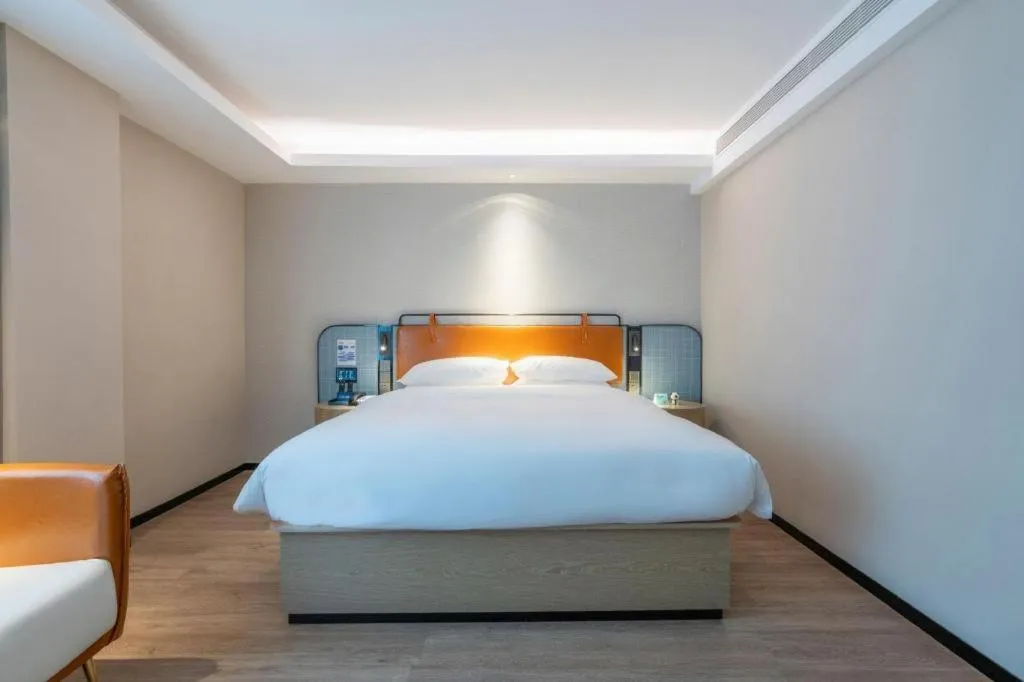 Bed in Echarm Hotel Guangzhou South Railway Station