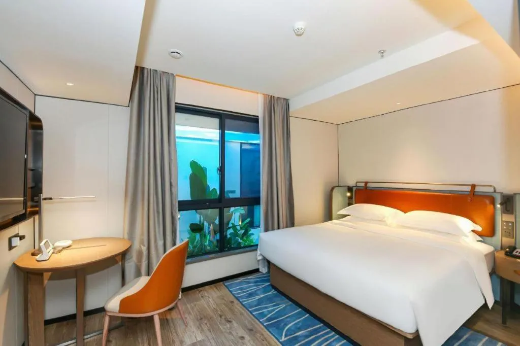 Bed in Echarm Hotel Guangzhou South Railway Station