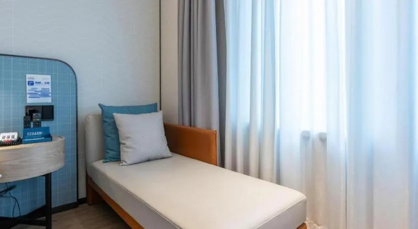 Bed in Echarm Hotel Guangzhou South Railway Station