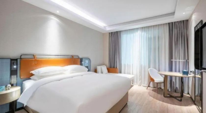 Bed in Echarm Hotel Guangzhou South Railway Station