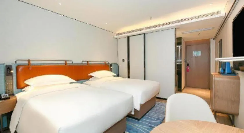 Bed in Echarm Hotel Guangzhou South Railway Station