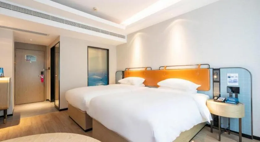 Bed in Echarm Hotel Guangzhou South Railway Station