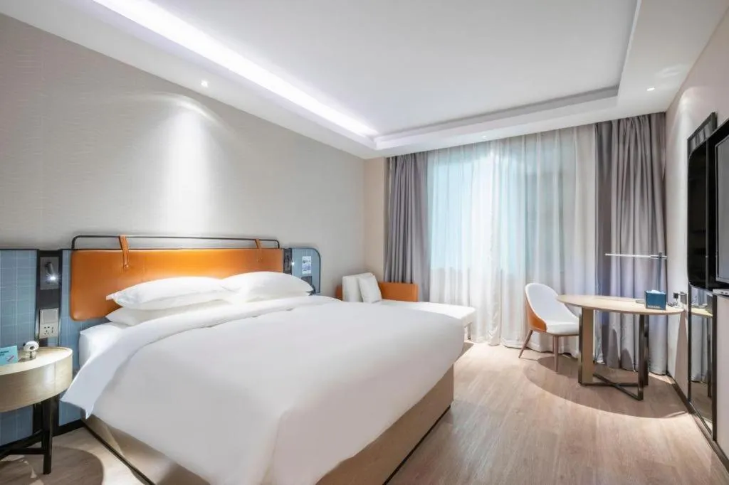 Bed in Echarm Hotel Guangzhou South Railway Station