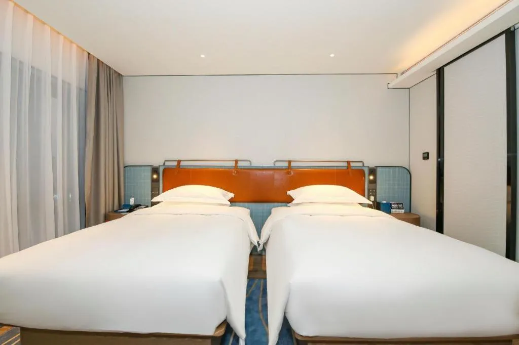 Bed in Echarm Hotel Guangzhou South Railway Station