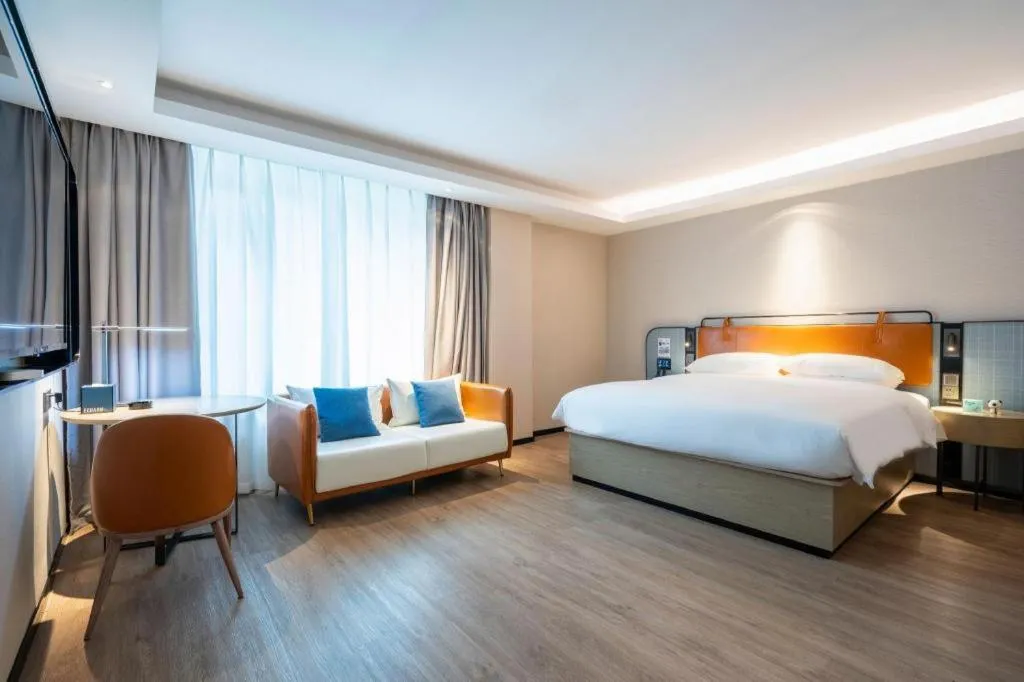 Bed in Echarm Hotel Guangzhou South Railway Station