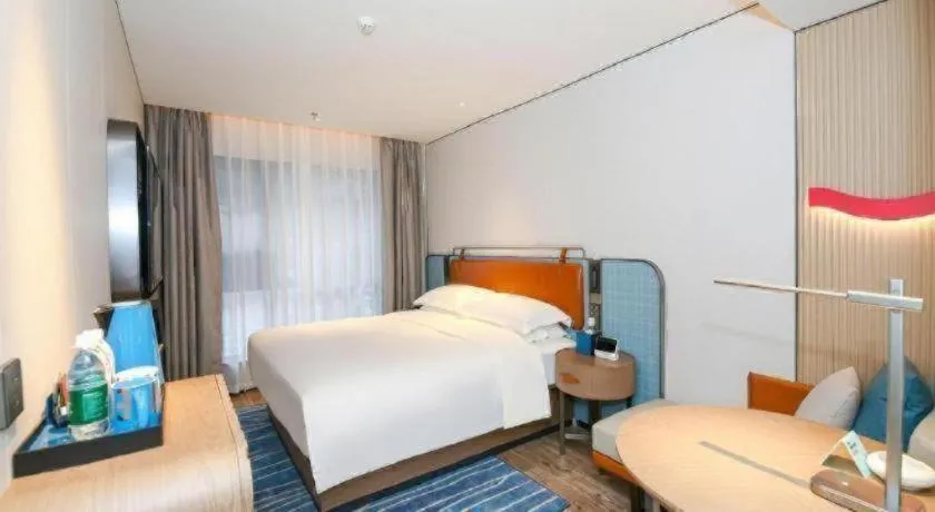 Bed in Echarm Hotel Guangzhou South Railway Station