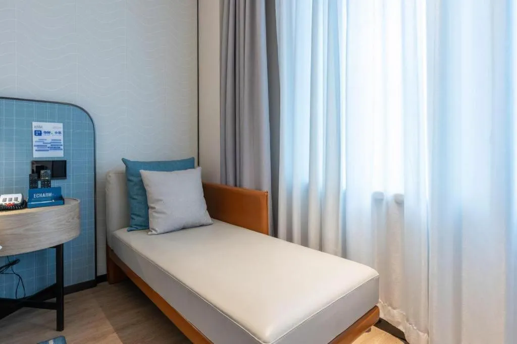 Bed in Echarm Hotel Guangzhou South Railway Station