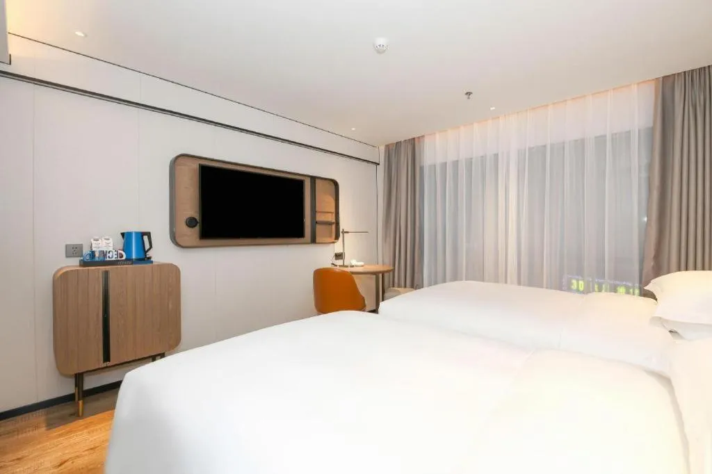 Bed in Echarm Hotel Guangzhou South Railway Station