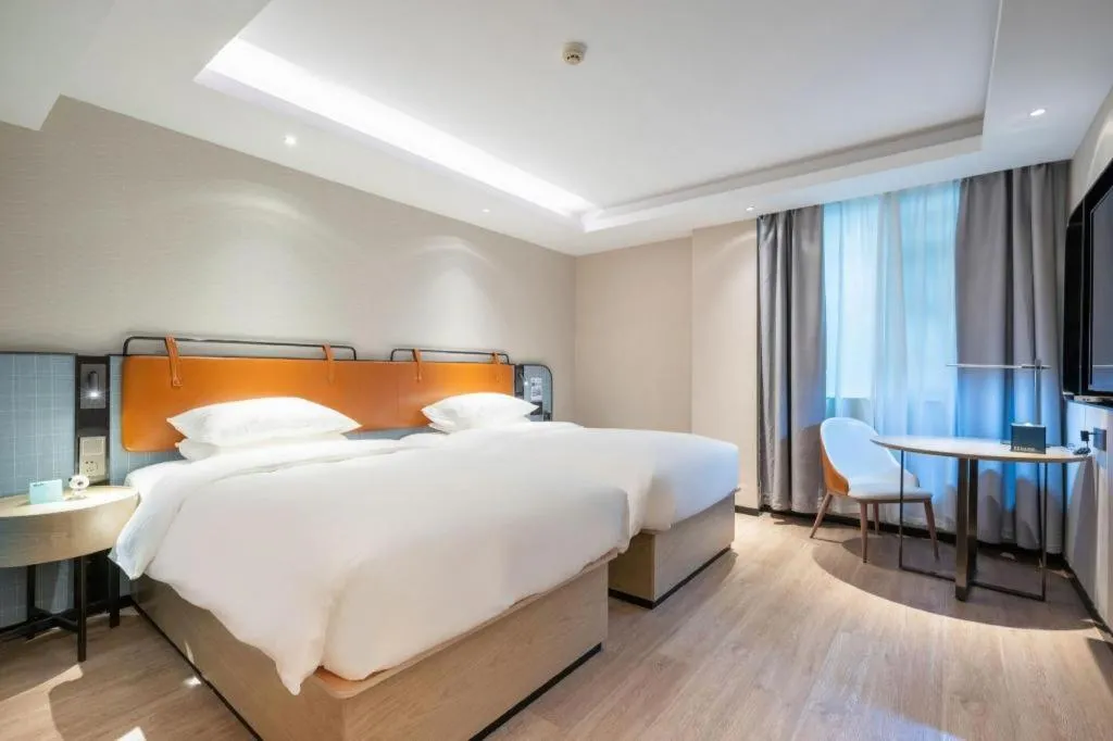 Bed in Echarm Hotel Guangzhou South Railway Station