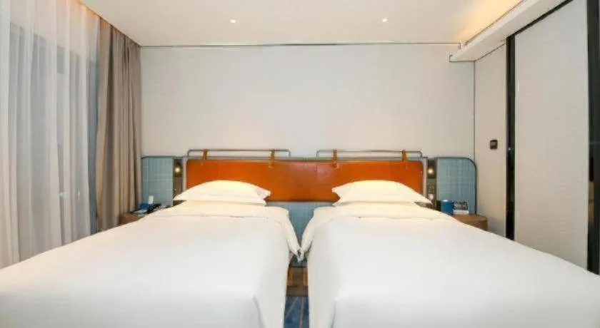 Bed in Echarm Hotel Guangzhou South Railway Station