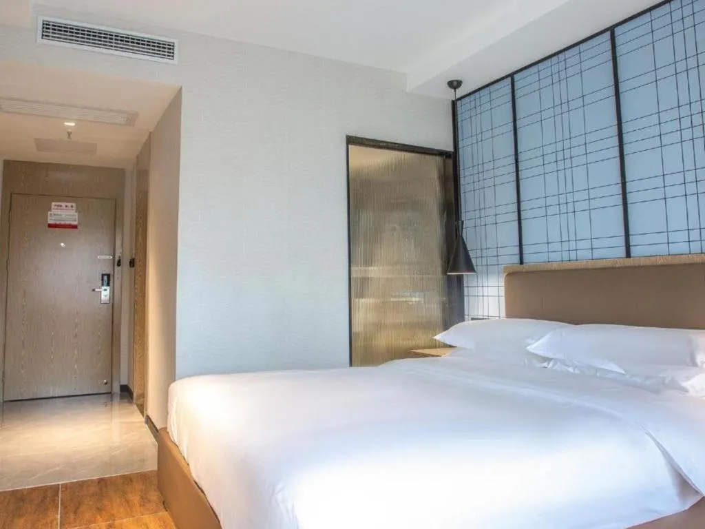 Bed in Echarm Hotel Changsha Yueliangdao Guanziling Metro Station