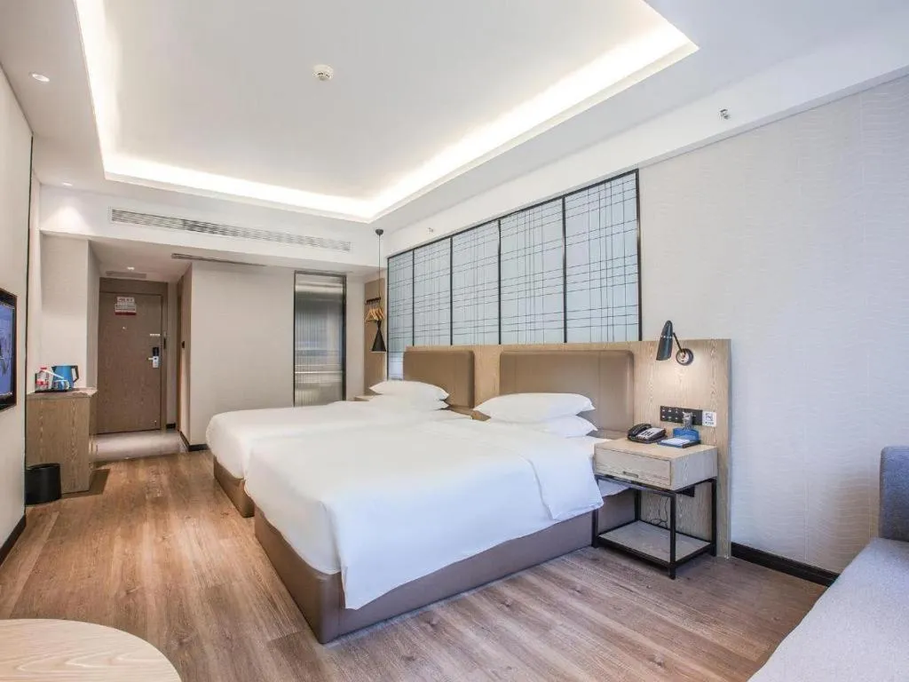 Bed in Echarm Hotel Changsha Yueliangdao Guanziling Metro Station