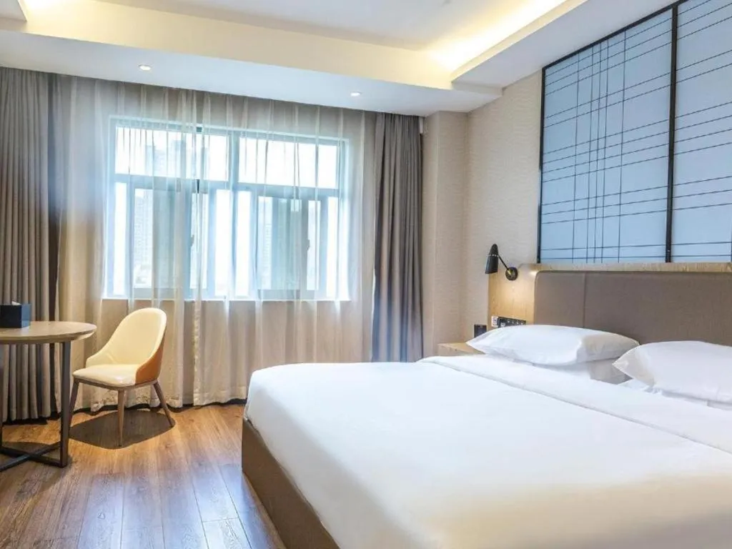 Bed in Echarm Hotel Changsha Yueliangdao Guanziling Metro Station
